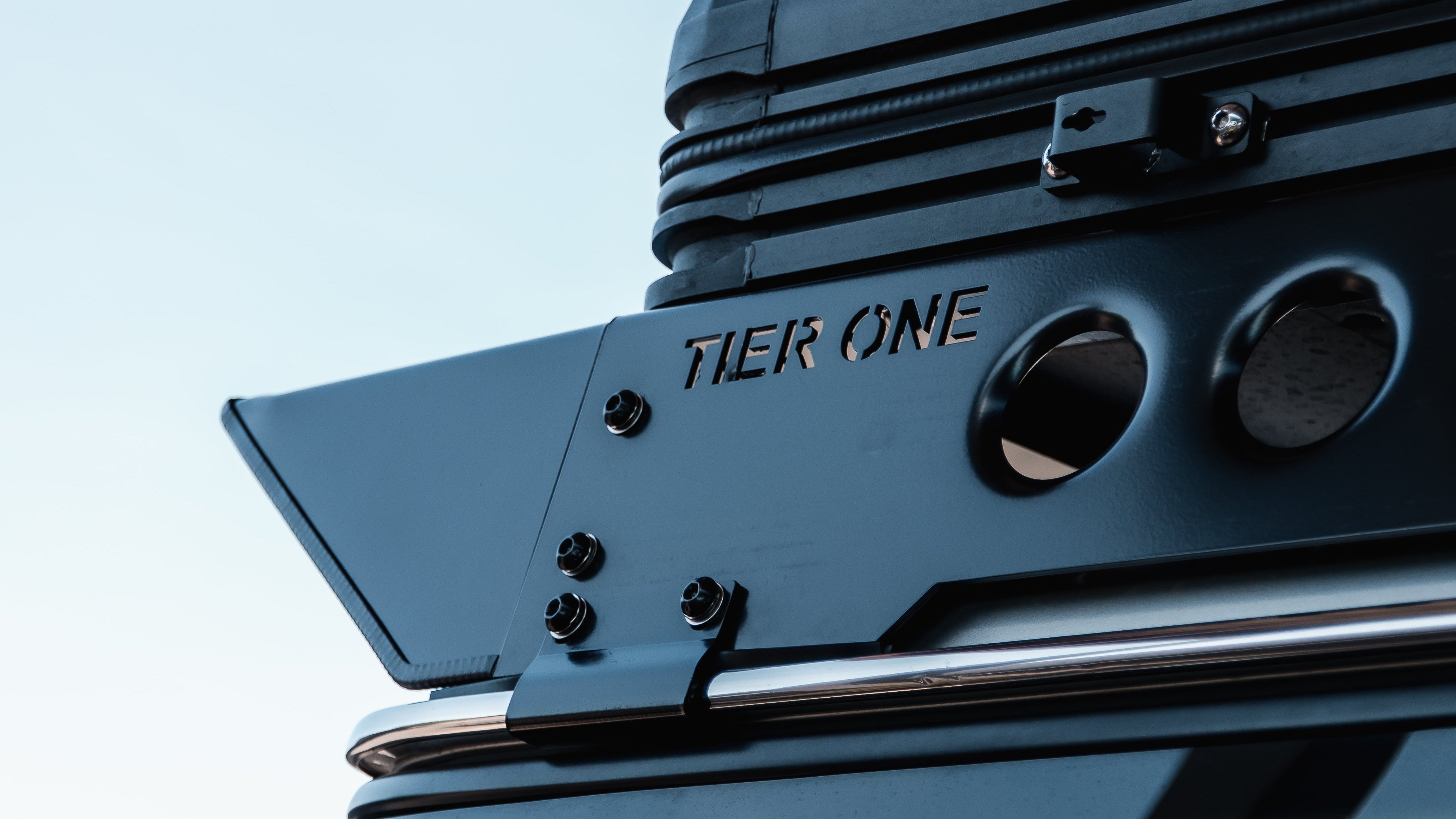 This is an image of Tier One Metalworks roof rack mounted on a vehicle with clear sky background