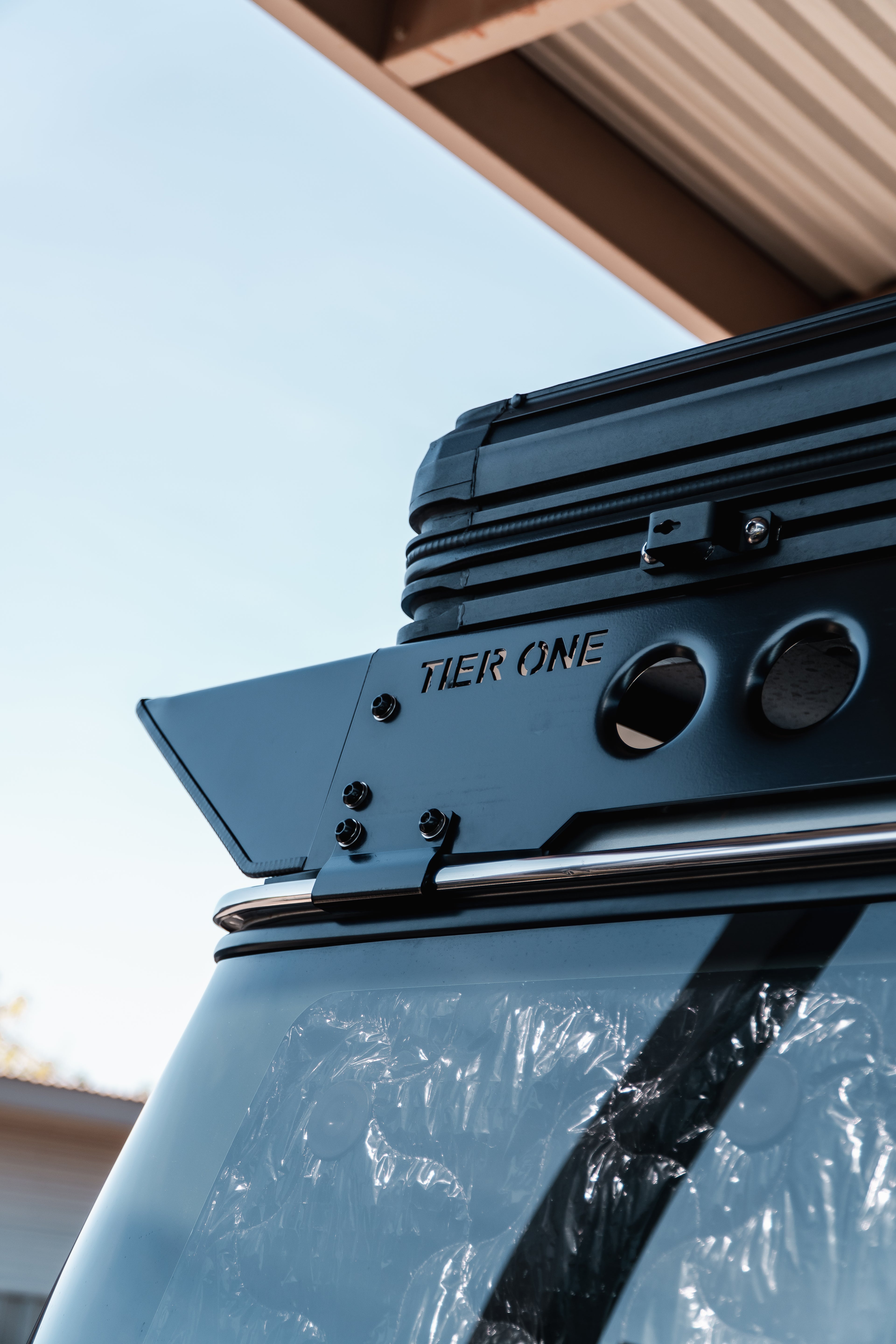 This is an image of Tier One Metalworks roof rack mounted on a vehicle with clear sky background